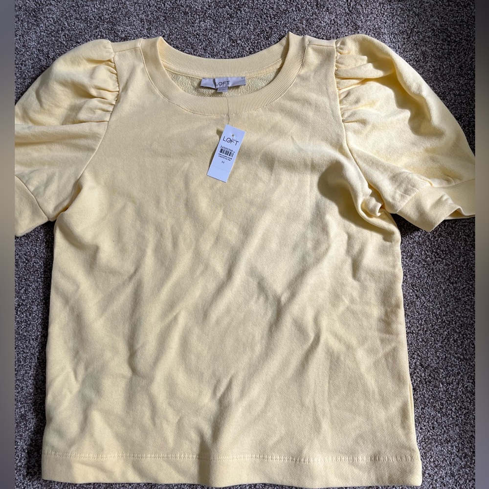 NWT Butter yellow blouse with pleated, puffy sleeves. Excellent condition.Size M